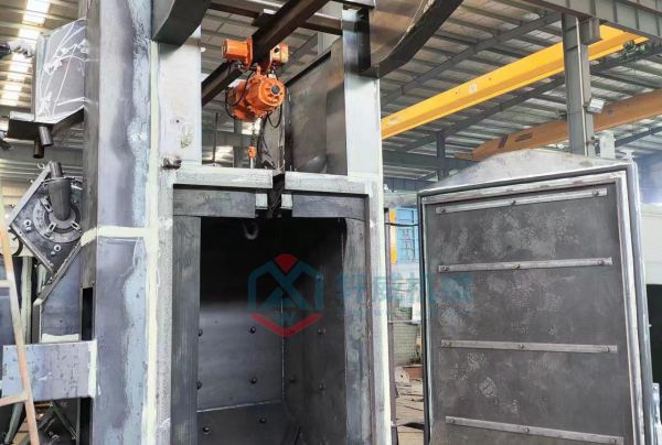 Production shot of integrated hook shot blasting machine