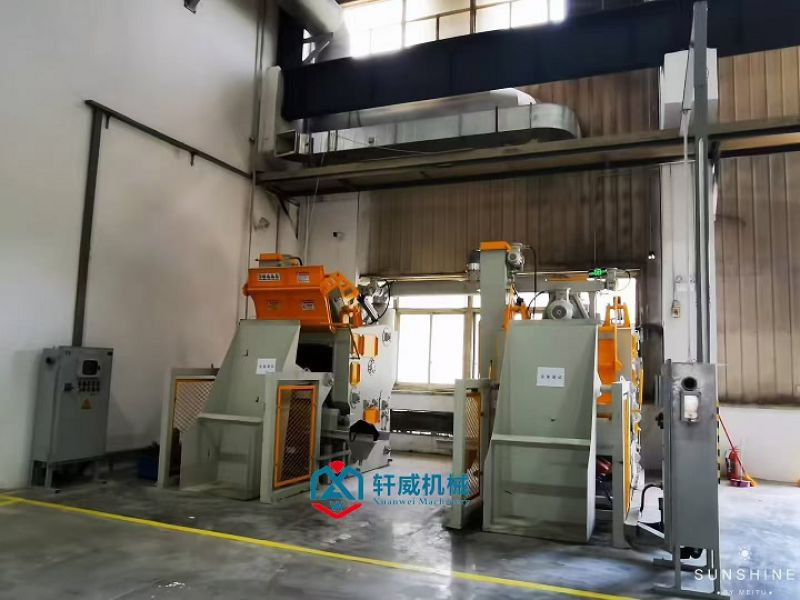 Automatic loading and unloading track shot blasting machine
